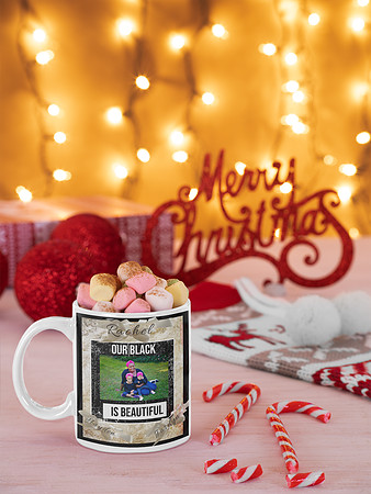 mockup-of-an-11-oz-mug-filled-with-marshmallows-in-a-christmas-setting-m46
