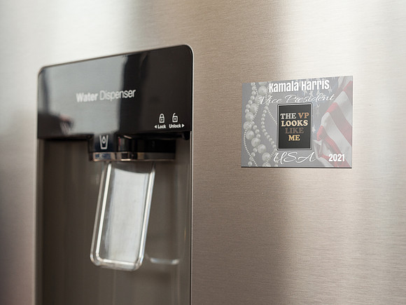 fridge-magnet-mockup-on-a-metallic-fridge-near-the-water-dispenser-a14790